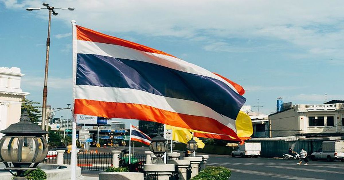 Thailand's flag flying over an intersection