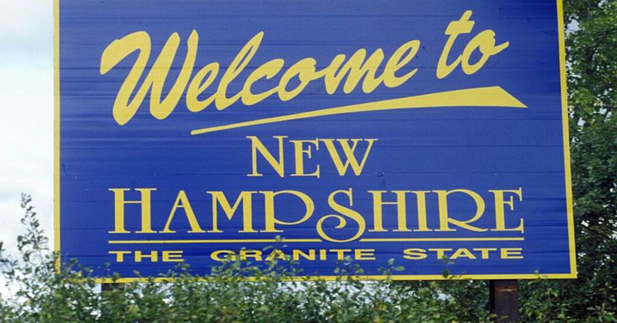 A Welcome to New Hampshire sign along the highway