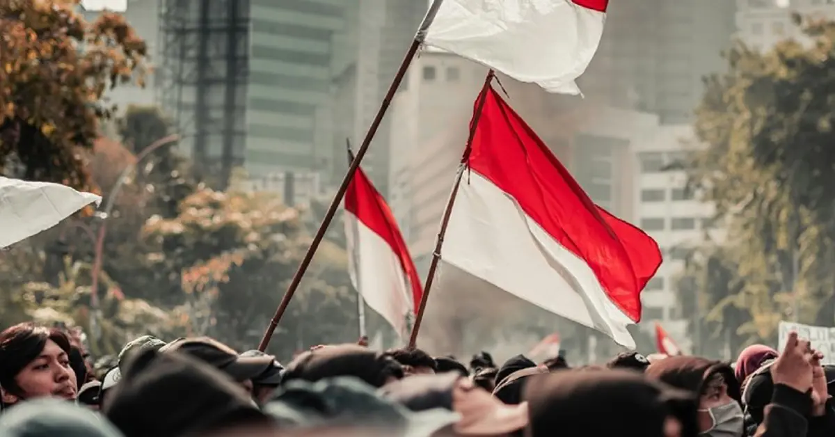 People waving Indonesian flags.